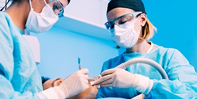 Dentists performing surgery