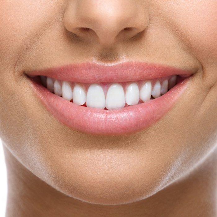 Close up of smile with straight white teeth