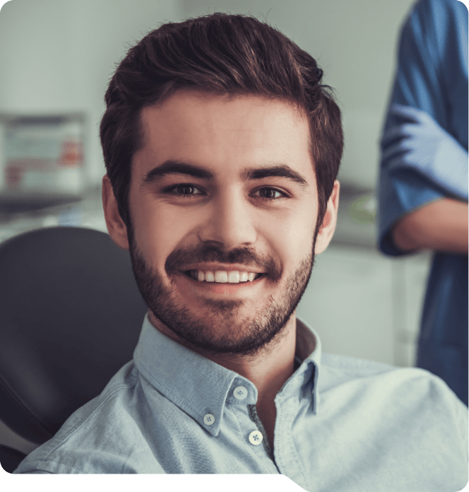 Smiling man sitting in dental chair