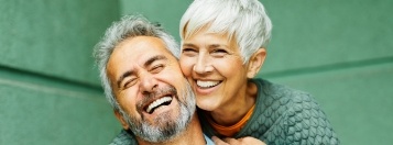 Older man and woman laughing together