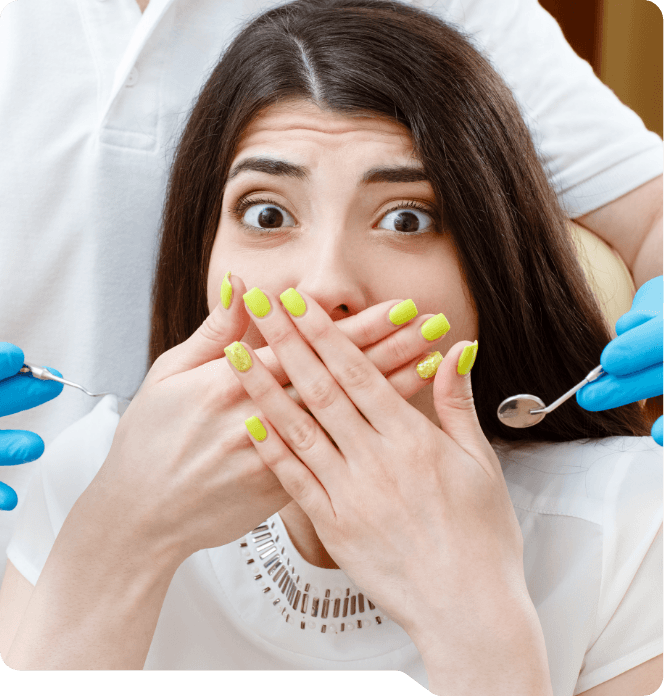 Dental patient covering her mouth with her hands while visiting sedation dentist in Grand Prairie